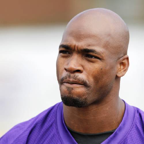 Minnesota Vikings running back Adrian Peterson is shown during the first day of the NFL teams training camp at Mankato State University in Mankato Minn. A federal appeals court has ruled that the NFL was