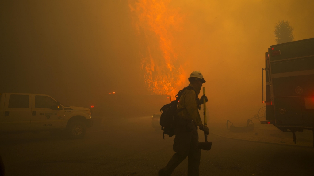 A firestorm engulfs the Mormon Rocks area in the San Bernardino National Forest off State Highway 138 in Phelan Calif. as the Blue Cut fire rages out of control Tuesday afternoon