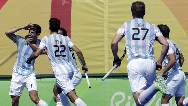 Argentina's Joaquin Menini left celebrates with teammates his goal against Germany