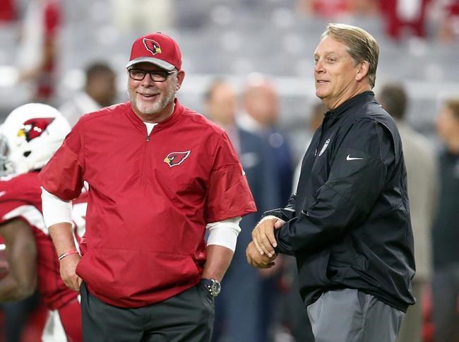 Arizona Cardinals coach Bruce Arians left talks with Oakland Raiders coach Jack Del Rio before an NFL preseason football game Friday Aug. 12 2016 in Glendale Ariz