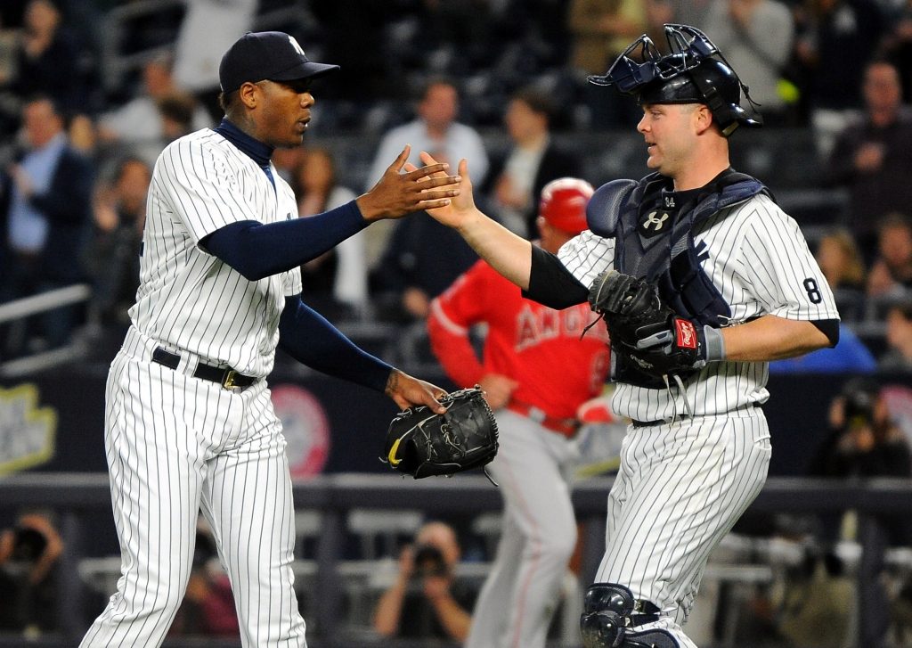 06/09/16 la angels vs ny yankees at yankee stadium bronx ny New York Yankees win 6-3 New York Yankees relief pitcher Aroldis Chapman #54 and New York Yankees catcher Brian Mc Cann #34 celebrate after the win tonite