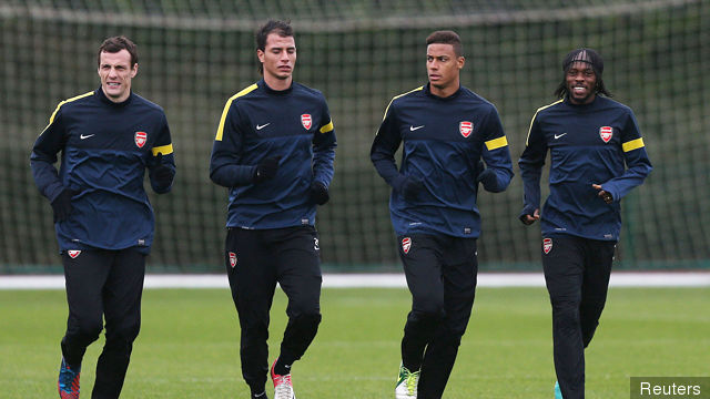 Arsenal's Sebastien Squillaci Marouane Chamakh Martin Angha and Gervinho during training