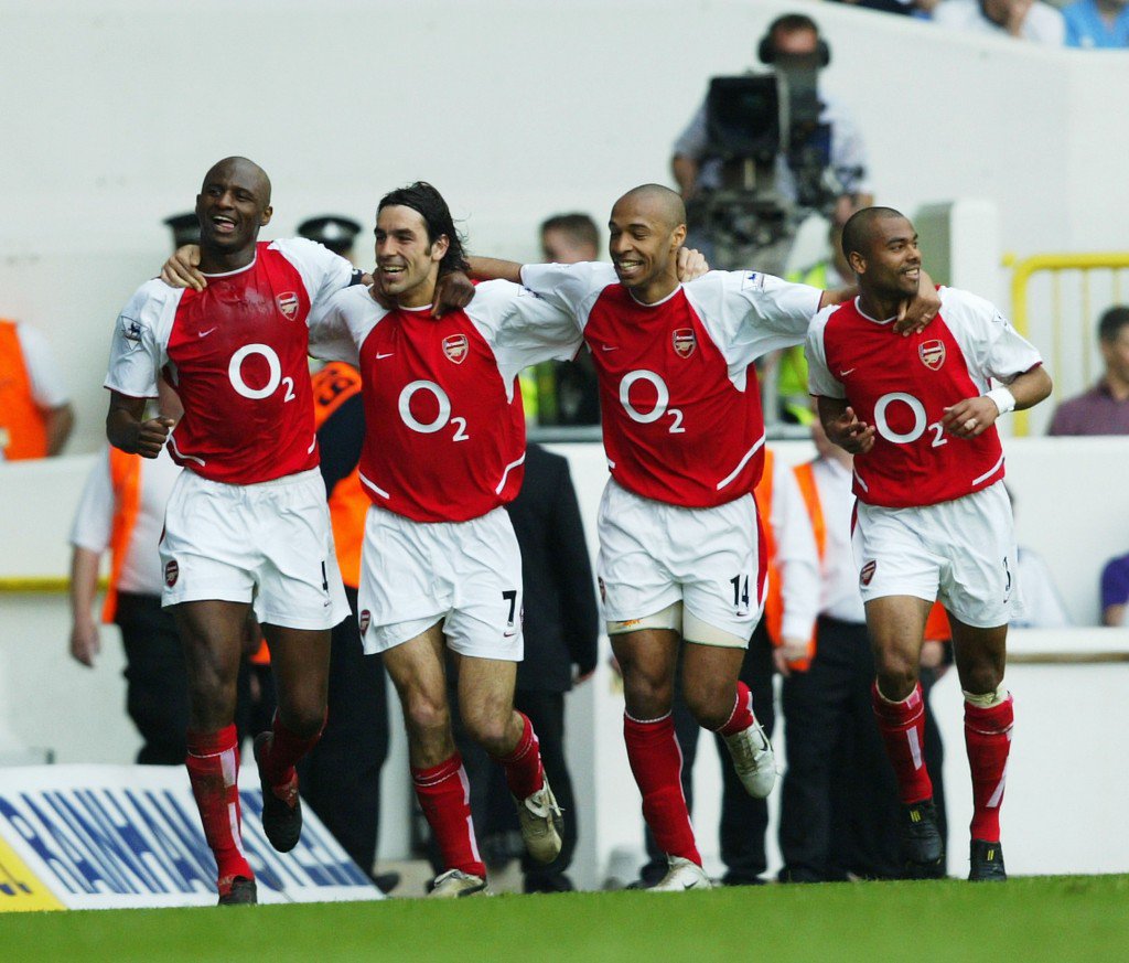 LONDON- APRIL 24 Patrick Viera,Robert Pires,Thierry Henry and Ashley Cole of Arsenal celebrate after the second goal during the FA Barclaycard Premiership match between Tottenham Hotspur and Arsenal at White Hart Lane