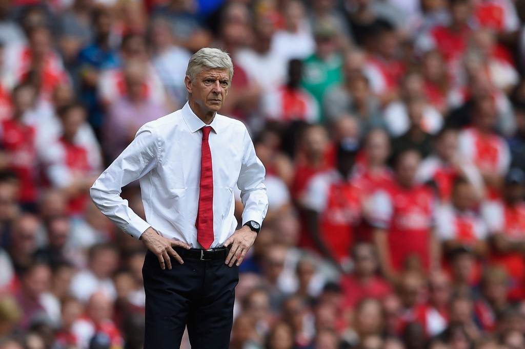 LONDON ENGLAND- AUGUST 09 Arsenal manager Arsene Wenger looks on during the Barclays Premier League match between Arsenal and West Ham United at Emirates Stadium