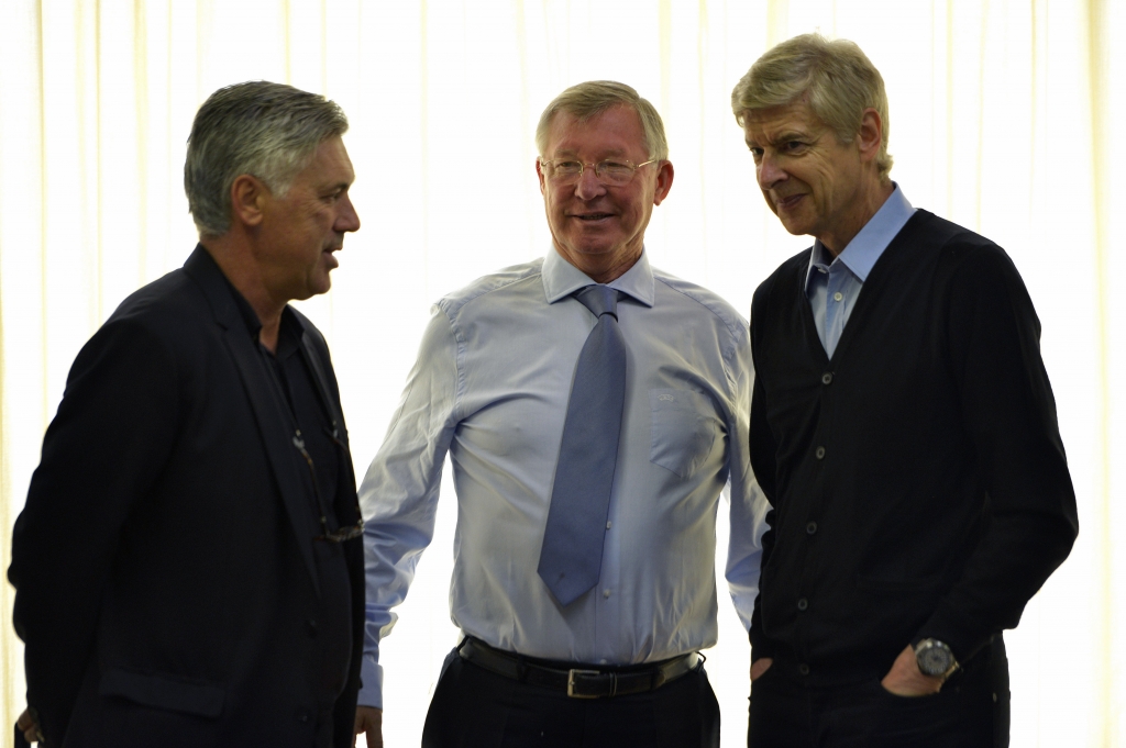 NYON SWITZERLAND- SEPTEMBER 04 Real Madrid Coach Carlo Ancelotti UEFA Elite Coaches Forum Chairman Sir Alex Ferguson and Arsenal FC Coach Arsene Wenger speak during the UEFA Elite Club Coaches Forum at the UEFA headquarters The House of European Foot