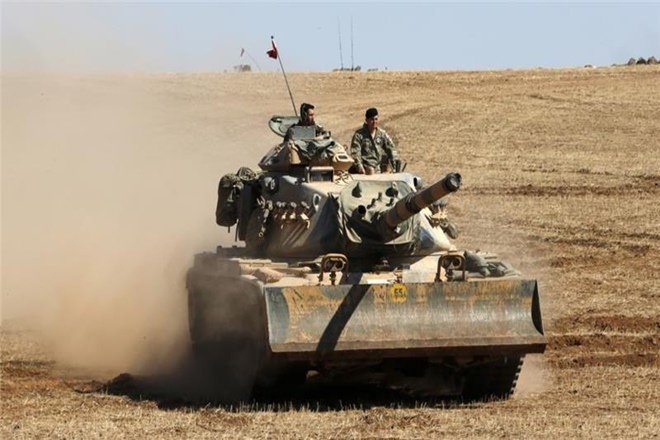 Artillery positions inside Turkey fired on the IS and Kurdish YPG militia targets in the towns of Jarablus and Manbij BBC reported