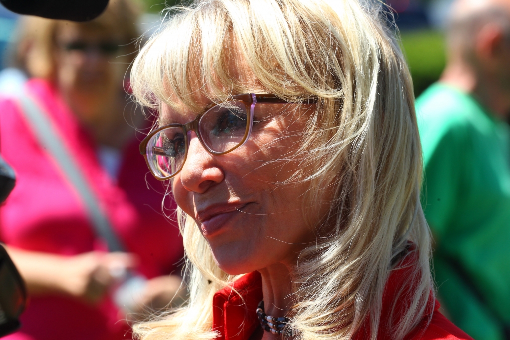 Artist Carolyn D. Palmer speaks with the media following the unveiling of the new statue