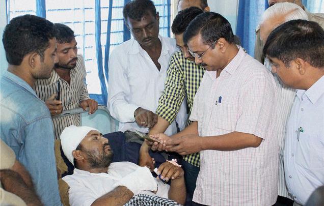 Delhi Chief Minister Arvind Kejriwal visits members of the Dalit community who had consumed poison in protest against last week’s assault by a cow protection gang in Rajkot on Friday PTI