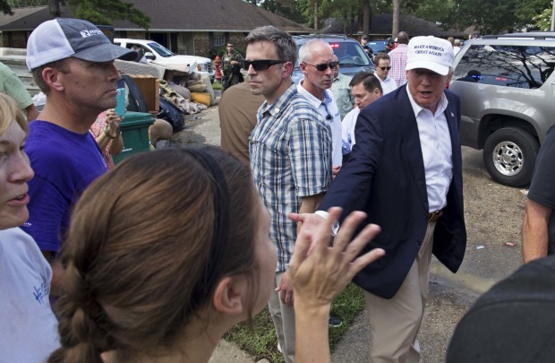 Republican presidential candidate Donald Trump greets flood victims during a tour of flood damaged homes in Denham Springs La. Friday Aug. 19 2016