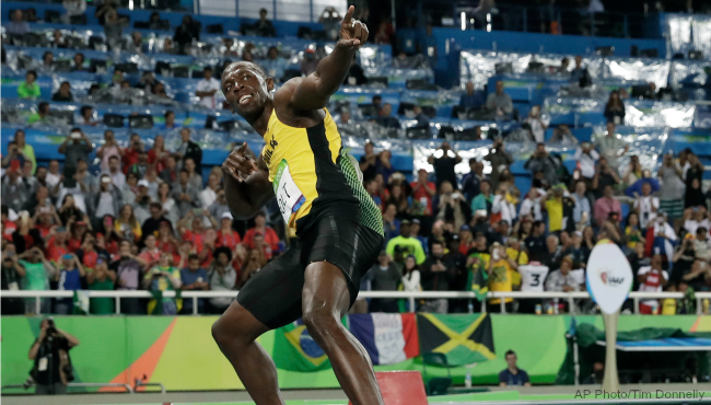 Usain Bolt from Jamaica celebrates after crossing the line to win the gold medal in the men's 200-meter final during the athletics competitions of the 2016 Summer Olympics at the Olympic stadium in Rio de Janeiro Brazil Thursday Aug. 18 2016. (AP Pho