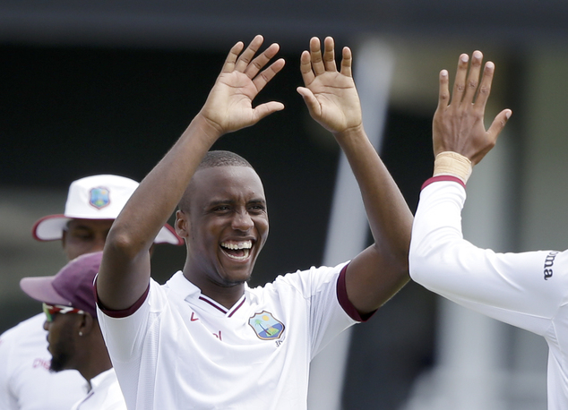 West Indies Miguel Cummins celebrates taking the wicket of India's Ishant Sharma during day two of their third cricket Test match at the Daren Sammy Cricket