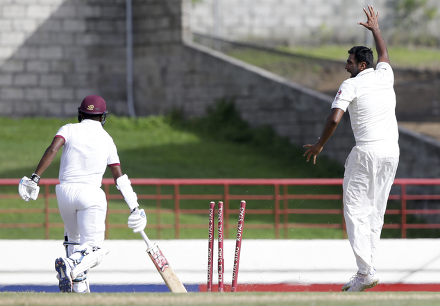 India's bowler Ravichandran Ashwin celebrates the dismissal of West Indies batsman Leon Johnson during day two of their third cricket Test match at the Dare