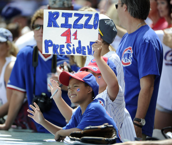 A couple of young Cubs fans watch their team’s 11-game winning streak end as the Cardinals score six in the eighth