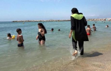 A woman wearing traditional Islamic dress waded in the Mediterranean in southern France last week