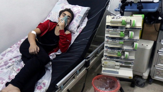 A civilian breathes through an oxygen mask at al Quds hospital after a gas believed to be chlorine was dropped