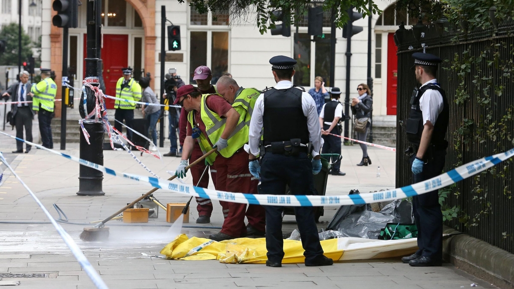 The crime scene in London's Russell Square is cleaned Thursday morning following a knife attack late Wednesday in which one woman was killed and five others injured