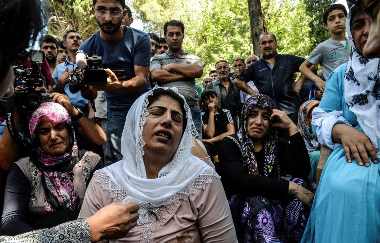 Women cry during a funeral for a victim of last night's attack on a wedding party that left 50 dead in Gaziantep in southeastern Turkey near the Syrian border