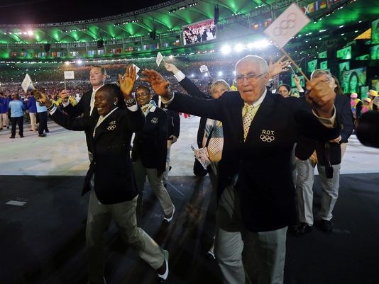 Athletes of the Refugee Olympic Team walk into the Maracana Stadium