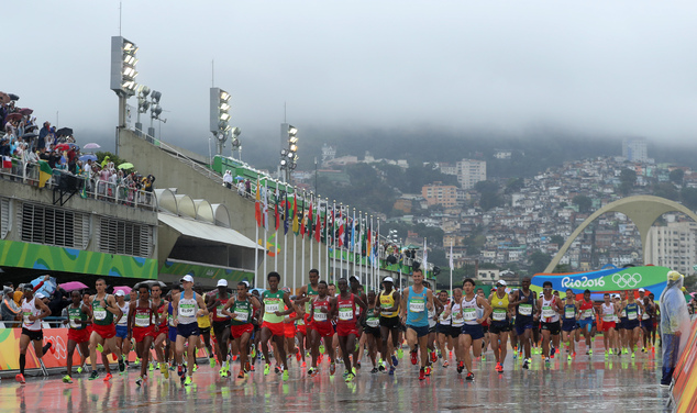 Athletes start to the men's marathon at the 2016 Summer Olympics in Rio de Janeiro Brazil Sunday Aug. 21 2016