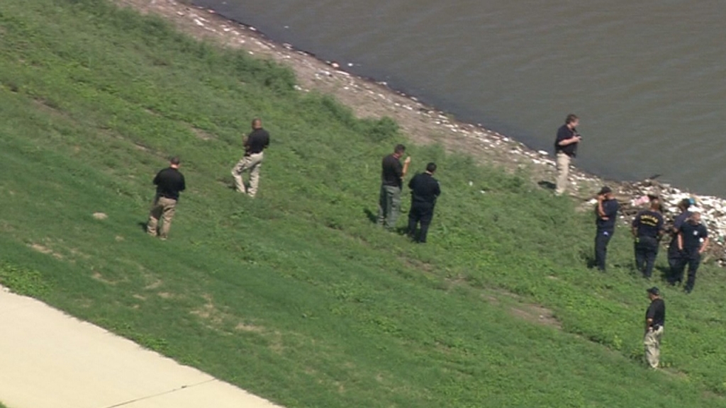 Authorities at scene where body found washed ashore at Trinity River levee in Dallas