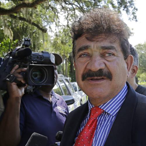 Seddique Mir Mateen father of Omar Mateen who died in a gun battle with a SWAT team after he opened fire at the gay nightclub Pulse early Sunday talks to reporters across the street of a residence owned