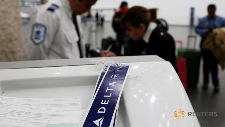 Baggage tags are seen near a counter of Delta Air Lines in Mexico City Mexico