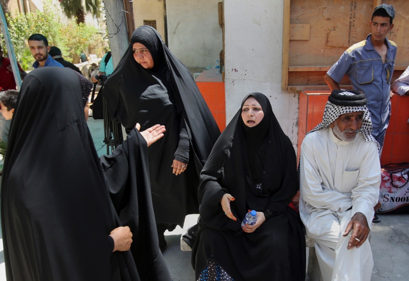 Families of newborn babies who died in a fire gather outside a maternity ward at Yarmouk Hospital in western Baghdad Iraq Wednesday Aug. 10 2016. A fire ripped through the maternity ward at the Baghdad hospital overnight killing at least 11 newborn