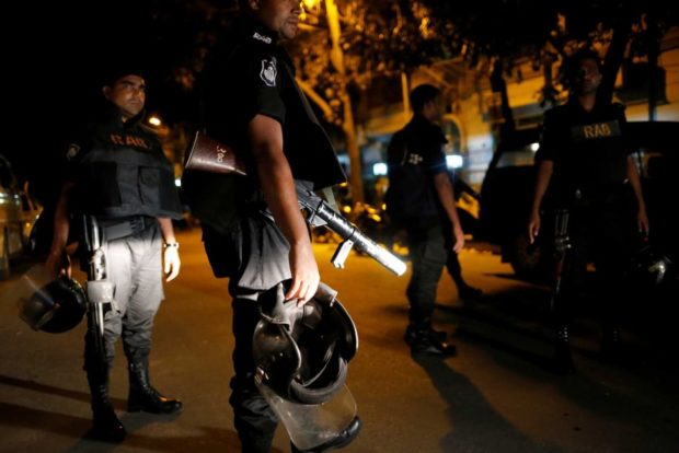 Bangladesh security personnel gather during the siege of the Dhaka café. Reuters