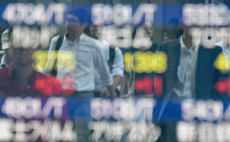 Asian shares flat, yen hits two-week high ahead of BOJ