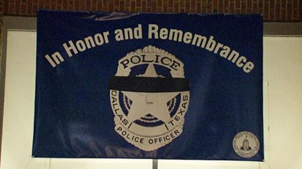 Banner outside the Somerville police station.               CBS Boston