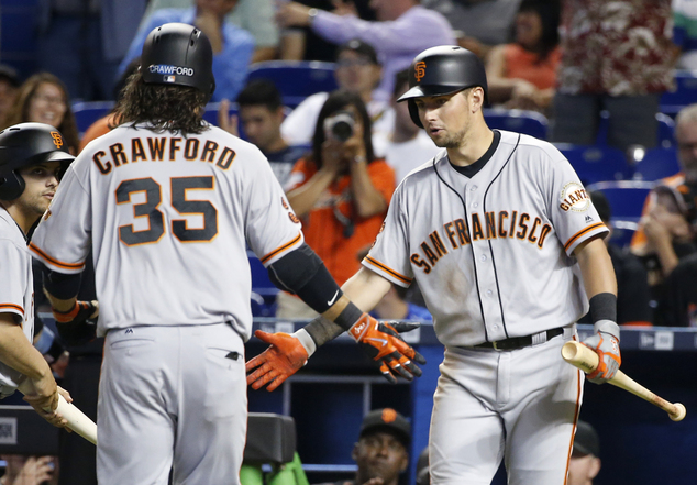 San Francisco Giants Brandon Crawford is congratulated by Joe Panik after Crawford hit a home run during the fourth inning of a baseball game against