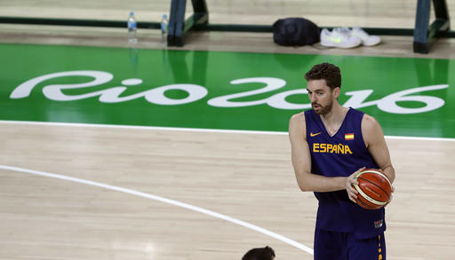 Spain's Pau Gasol looks to pass the ball during a basketball practice session for the 2016 Summer Olympics in Rio de Janeiro Brazil Thursday Aug. 4 2016. AP