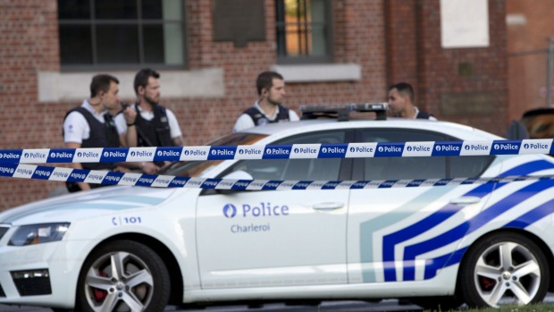 Police secure the scene near the police headquarters in Charleroi Belgium after two female officers were attacked and