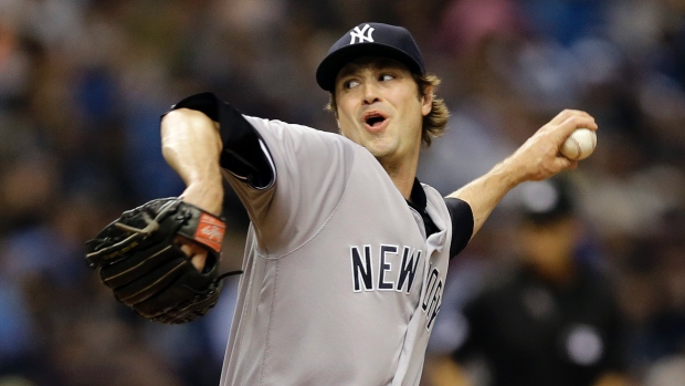 New York Yankees relief pitcher Andrew Miller delivers to the Tampa Bay Rays during the eighth inning of a baseball game in St. Petersburg Fla