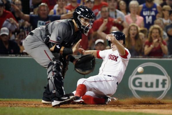 Boston Red Sox's Brock Holt right scores