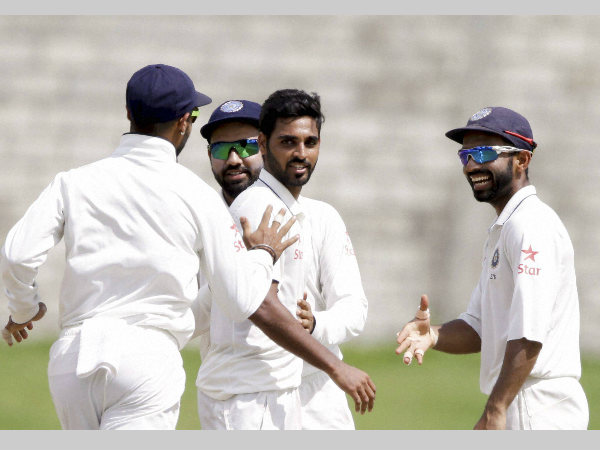 Bhuvneshwar Kumar is congratulated by his team-mates after dismissing Shane Dowrich on Dayrd Test against West Indies