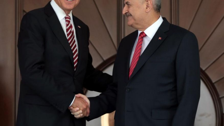 U.S Vice President Joe Biden left shakes hands with Turkish Prime Minister Binali Yildirim as he arrives for a meeting in Ankara Turkey Wednesday Aug. 24 2016. Biden has arrived in Ankara for talks with Turkish leaders as Turkey launched a military