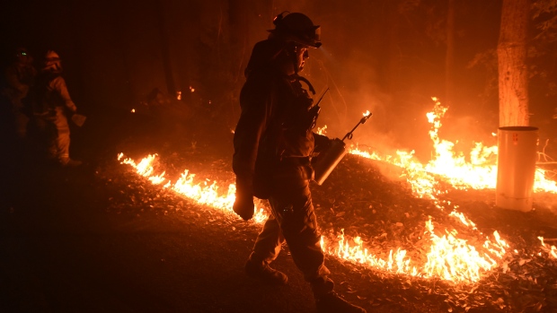 Firefighter Brendon Gorman ignites backfire to stop the Soberanes Fire's spread along Palo Colorado Road near Big Sur Calif. on July 27