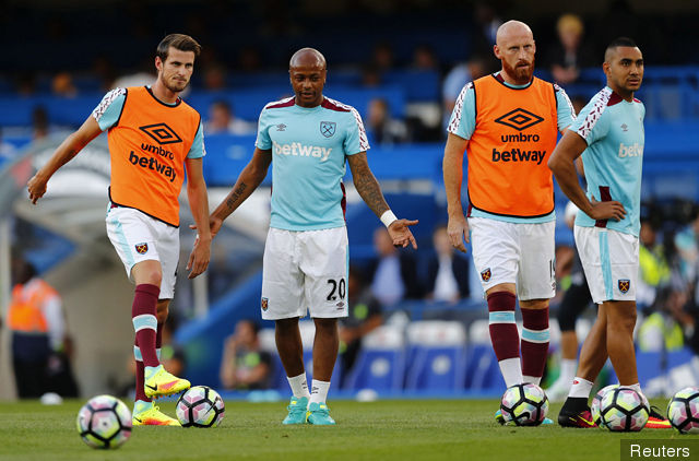 West Ham United's Havard Nordtveit Andre Ayew James Collins and Dimitri Payet warm up before the match