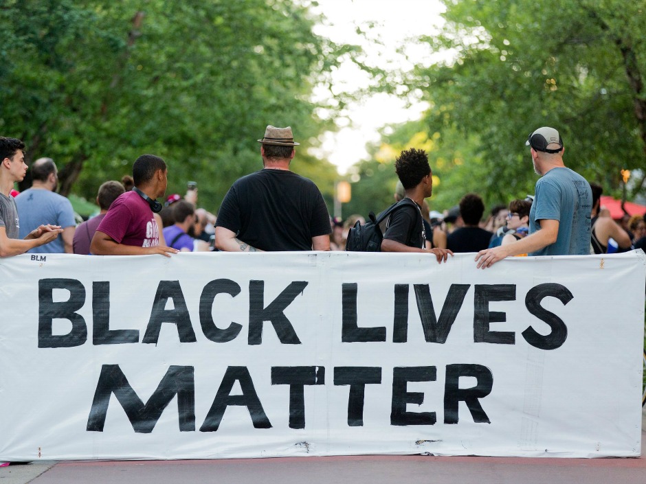 Demonstrators in Miami Fla. protesting the failure of grand juries to indict the police officers responsible for the deaths of Michal Brown in Ferguson Missouri and Eric Garner in New York