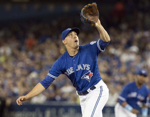 Toronto Blue Jays starting pitcher Aaron Sanchez fields an infield ground ball off the bat of Baltimore Orioles Adam Jones during first inning of a baseball