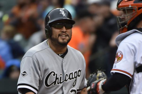 Chicago White Sox's Dioner Navarro right celebrates his two-run home run with Avisail Garcia as Philadelphia Phillies catcher Cameron Rupp waits during the sixth inning of a baseball game Wednesday Aug. 24 2016 in Chicago. (AP