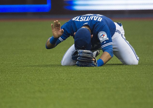 Toronto Blue Jays right fielder Jose Bautista reacts after a throwing error on a single by Tampa Bay Rays Kevin Kiermaier during the third inning of a base