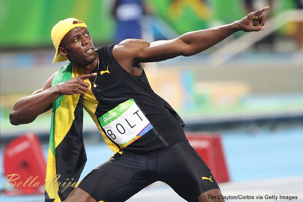 Athletics- Olympics Day 9 Usain Bolt of Jamaica strikes his'Lightening Bolt pose after winning the Men's 100m Final at the Olympic Stadium