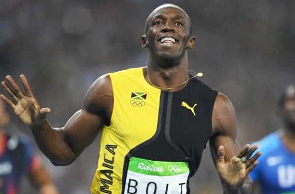 Bolt celebrates after winning the 100m