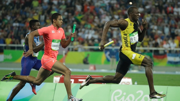 Jamaica's Usain Bolt right competes in the men's 4x100-meter relay final during the athletics competitions of the 2016 Summer Olympics at the Olympic stadium in Rio de Janeiro Brazil. | AP