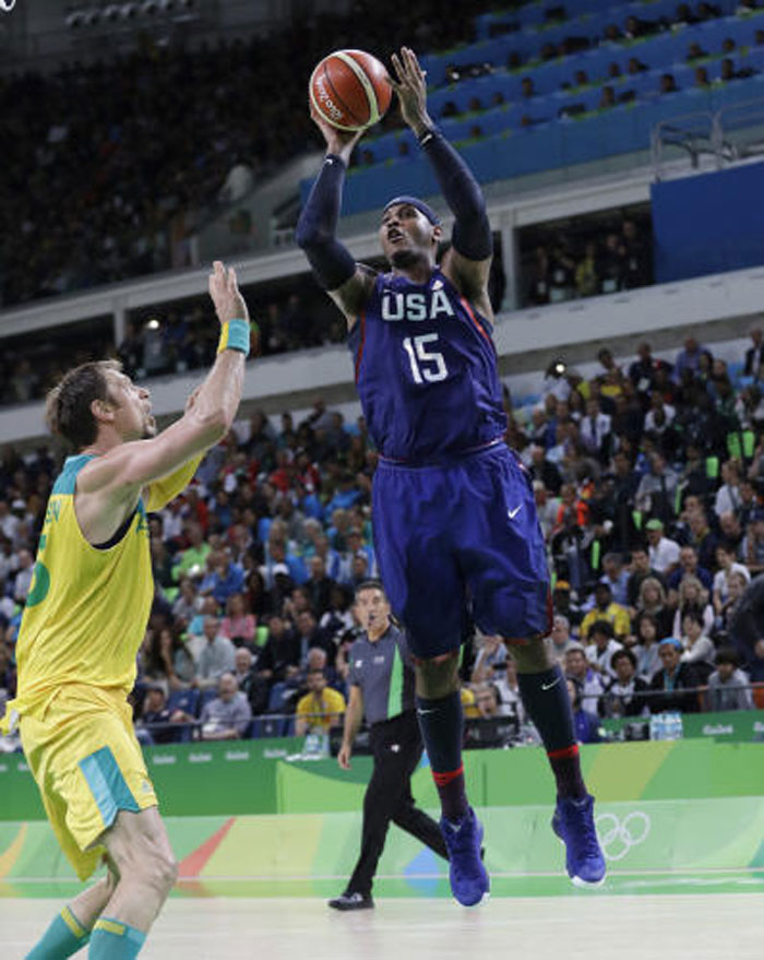 Carmelo Anthony of the US shoots over Australia's David Andersen during their basketball game at the 2016 Summer Olympics in Rio de Janeiro Wednesday. — AP