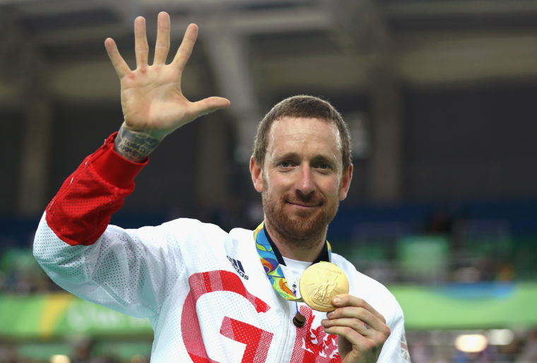 Bradley Wiggins poses with his fifth gold medal in his career after victory in the Men's Team Pursuit