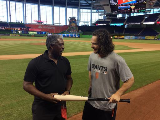 Rennie Stennett left and San Francisco Giants Brandon Crawford chat about the NL record they share before the start of a baseball game Wednesday Aug. 10 2016 in Miami. Crawford tied the record with seven hits in Monday's 1