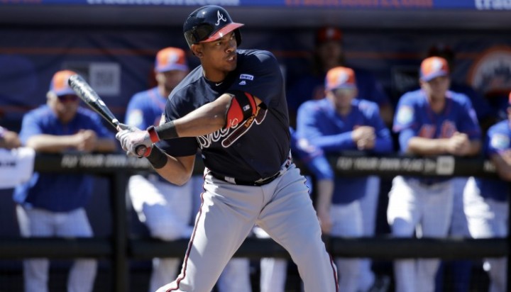 Atlanta Braves&#039 Hector Olivera bats during a spring training baseball game against the New York Mets in Port St. Lucie Fla. Olivera was suspended through Aug. 1 for his arrest on domestic violence charges. T